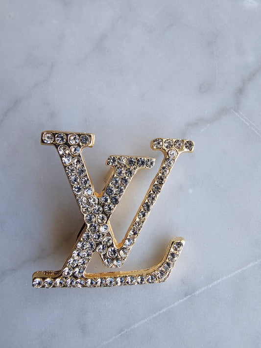 Lv brooch